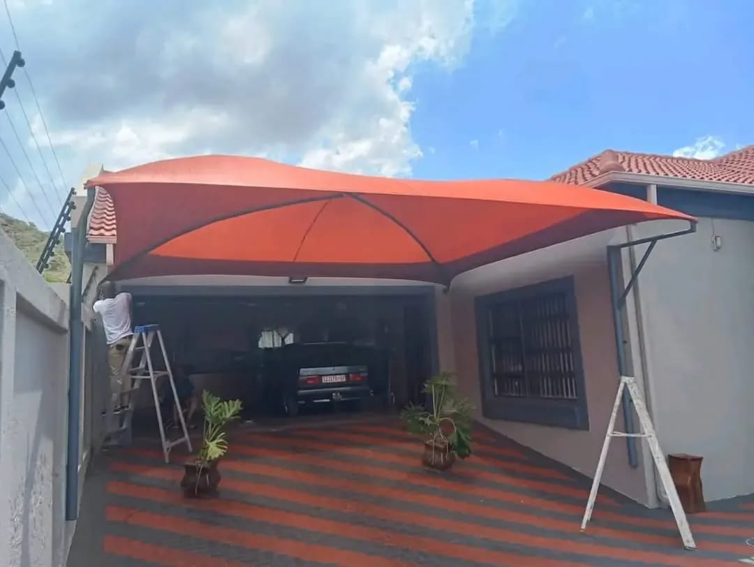 Red membrane shade structure installed by CPS